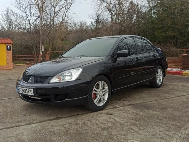Чорний Міцубісі Lancer, об'ємом двигуна 2 л та пробігом 267 тис. км за 5200 $, фото 1 на Automoto.ua