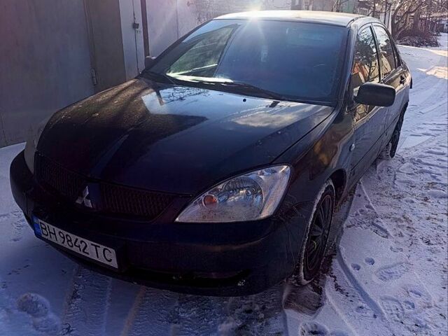 Черный Мицубиси Лансер, объемом двигателя 1.6 л и пробегом 300 тыс. км за 2200 $, фото 1 на Automoto.ua