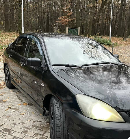 Чорний Міцубісі Lancer, об'ємом двигуна 1.6 л та пробігом 200 тис. км за 3000 $, фото 1 на Automoto.ua