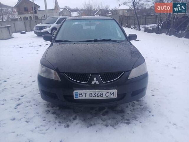 Чорний Міцубісі Lancer, об'ємом двигуна 1.6 л та пробігом 275 тис. км за 2999 $, фото 1 на Automoto.ua