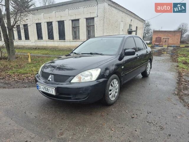 Черный Мицубиси Лансер, объемом двигателя 1.58 л и пробегом 280 тыс. км за 3200 $, фото 1 на Automoto.ua
