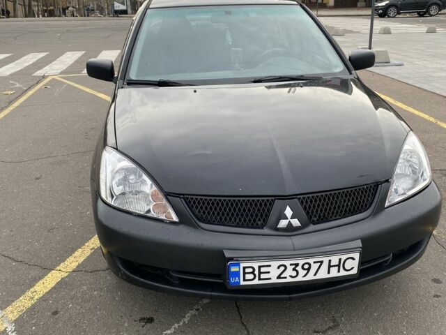 Черный Мицубиси Лансер, объемом двигателя 1.6 л и пробегом 350 тыс. км за 2900 $, фото 1 на Automoto.ua