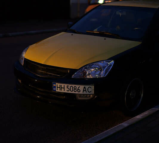 Черный Мицубиси Лансер, объемом двигателя 1.6 л и пробегом 215 тыс. км за 5800 $, фото 1 на Automoto.ua