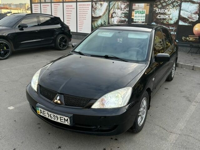 Чорний Міцубісі Lancer, об'ємом двигуна 1.58 л та пробігом 230 тис. км за 3499 $, фото 1 на Automoto.ua