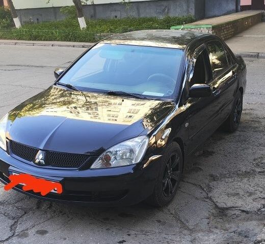 Мицубиси Лансер 2005 в Южноукраинске на Automoto.ua Черный Мицубиси Лансер, объемом двигателя 1.6 л и пробегом 350 тыс. км за 3099 $, фото 1 на Automoto.ua