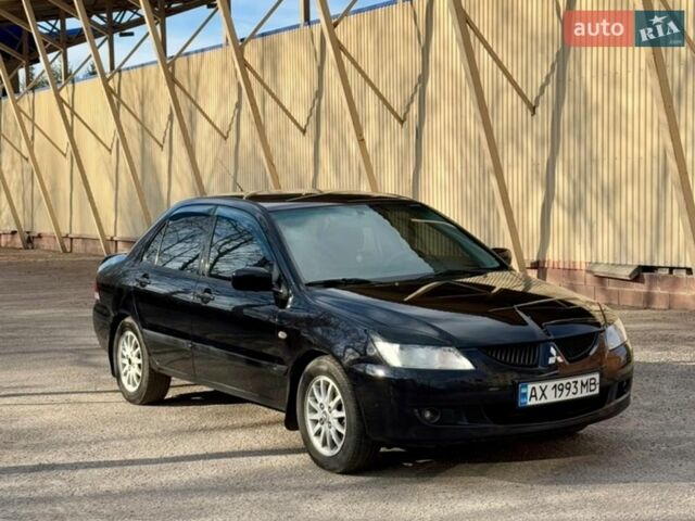 Черный Мицубиси Лансер, объемом двигателя 1.58 л и пробегом 270 тыс. км за 3900 $, фото 1 на Automoto.ua