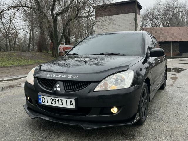 Чорний Міцубісі Lancer, об'ємом двигуна 1.6 л та пробігом 258 тис. км за 4100 $, фото 1 на Automoto.ua