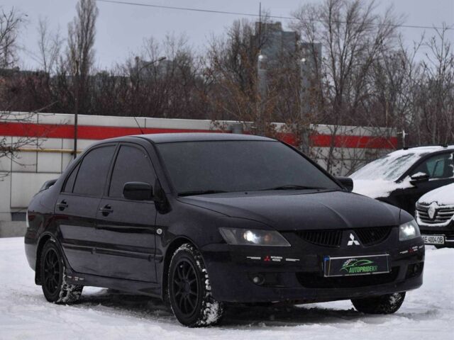 Черный Мицубиси Лансер, объемом двигателя 2 л и пробегом 266 тыс. км за 4450 $, фото 1 на Automoto.ua
