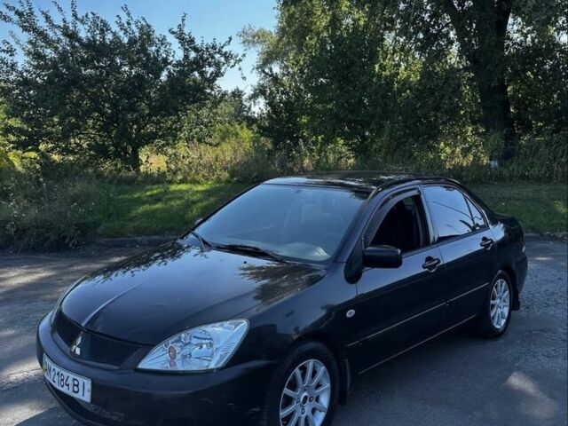 Чорний Міцубісі Lancer, об'ємом двигуна 1.6 л та пробігом 1 тис. км за 1550 $, фото 1 на Automoto.ua