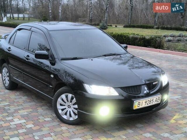 Чорний Міцубісі Lancer, об'ємом двигуна 1.58 л та пробігом 263 тис. км за 4500 $, фото 1 на Automoto.ua