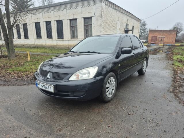 Черный Мицубиси Лансер, объемом двигателя 1.6 л и пробегом 280 тыс. км за 3200 $, фото 1 на Automoto.ua