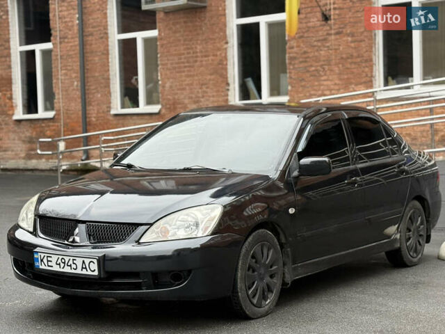 Черный Мицубиси Лансер, объемом двигателя 1.58 л и пробегом 198 тыс. км за 3700 $, фото 1 на Automoto.ua