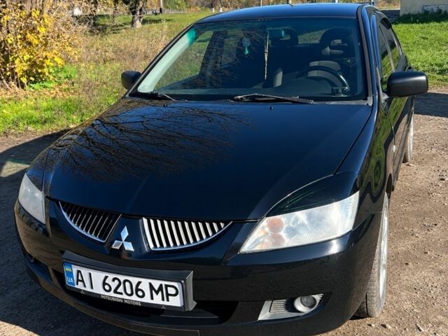 Чорний Міцубісі Lancer, об'ємом двигуна 1.6 л та пробігом 370 тис. км за 3700 $, фото 1 на Automoto.ua