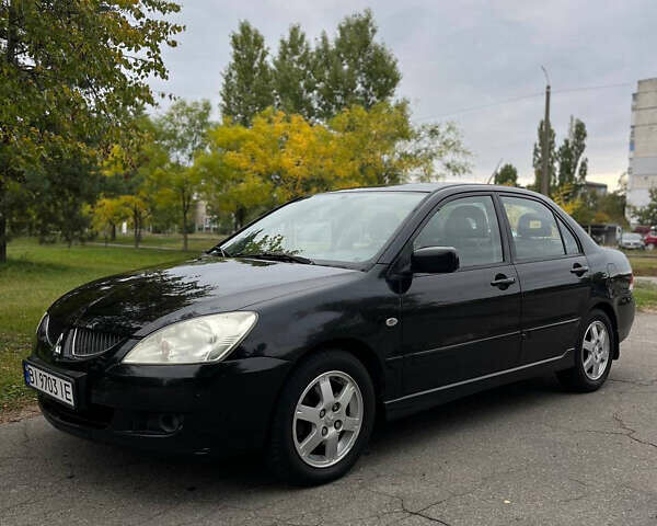 Чорний Міцубісі Lancer, об'ємом двигуна 1.58 л та пробігом 117 тис. км за 4500 $, фото 1 на Automoto.ua