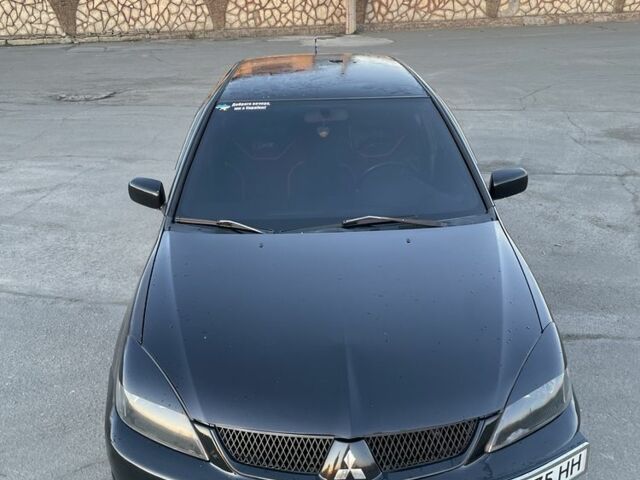 Черный Мицубиси Лансер, объемом двигателя 2 л и пробегом 50 тыс. км за 4500 $, фото 1 на Automoto.ua