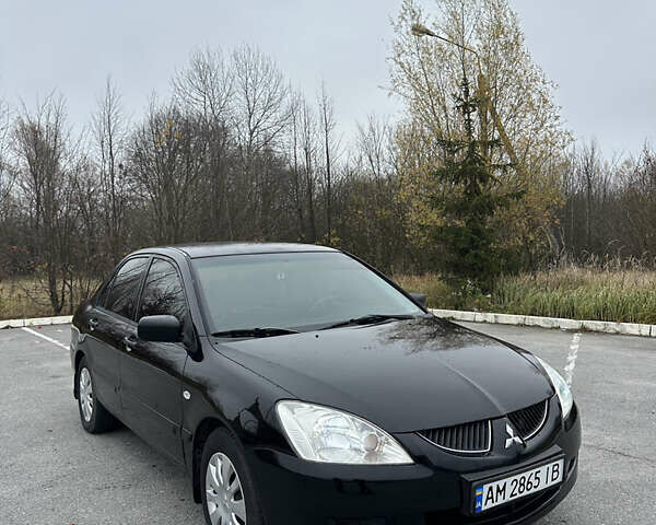 Черный Мицубиси Лансер, объемом двигателя 1.6 л и пробегом 200 тыс. км за 3499 $, фото 1 на Automoto.ua