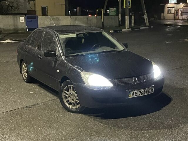 Черный Мицубиси Лансер, объемом двигателя 1.6 л и пробегом 200 тыс. км за 3499 $, фото 1 на Automoto.ua
