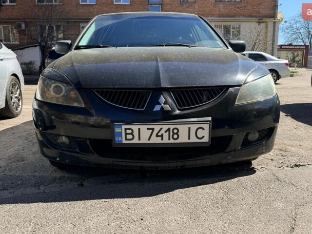 Чорний Міцубісі Lancer, об'ємом двигуна 1.58 л та пробігом 222 тис. км за 3500 $, фото 1 на Automoto.ua