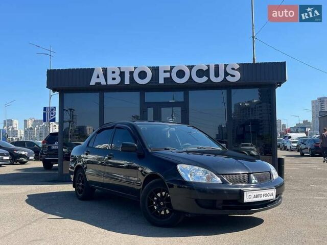 Черный Мицубиси Лансер, объемом двигателя 1.58 л и пробегом 310 тыс. км за 5690 $, фото 1 на Automoto.ua