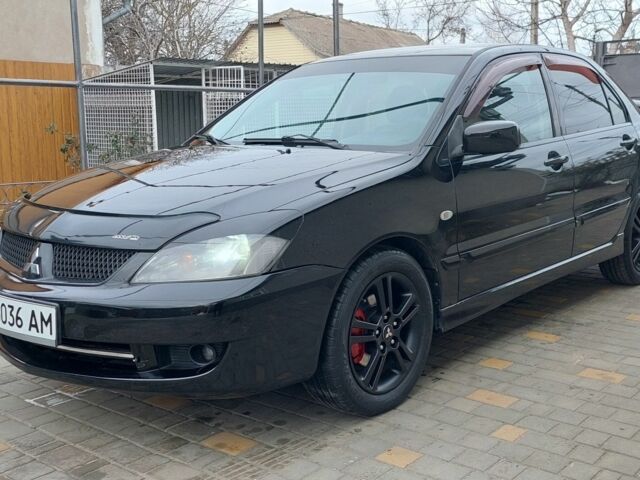Чорний Міцубісі Lancer, об'ємом двигуна 2 л та пробігом 231 тис. км за 4350 $, фото 1 на Automoto.ua