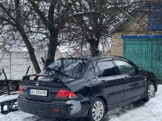 Чорний Міцубісі Lancer, об'ємом двигуна 1.6 л та пробігом 350 тис. км за 2400 $, фото 1 на Automoto.ua
