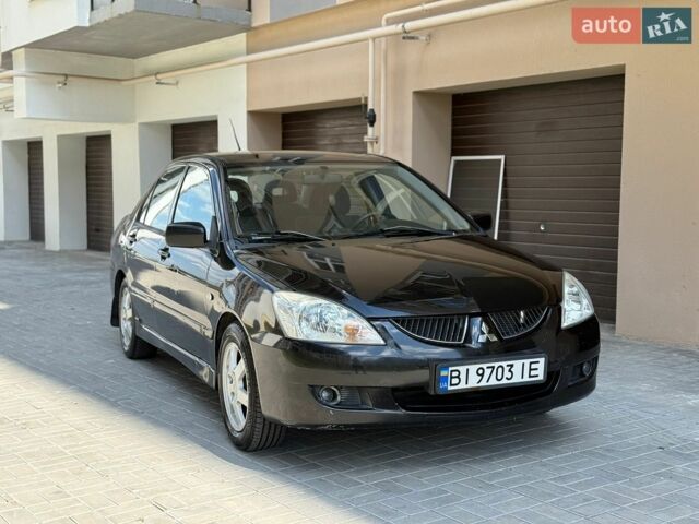 Чорний Міцубісі Lancer, об'ємом двигуна 1.6 л та пробігом 126 тис. км за 3650 $, фото 1 на Automoto.ua