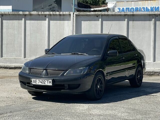 Чорний Міцубісі Lancer, об'ємом двигуна 1.6 л та пробігом 320 тис. км за 3599 $, фото 1 на Automoto.ua