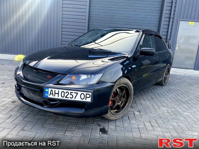 Чорний Міцубісі Lancer, об'ємом двигуна 2 л та пробігом 199 тис. км за 2150 $, фото 1 на Automoto.ua