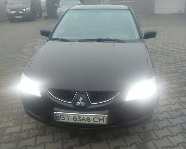 Чорний Міцубісі Lancer, об'ємом двигуна 1.58 л та пробігом 275 тис. км за 3100 $, фото 1 на Automoto.ua