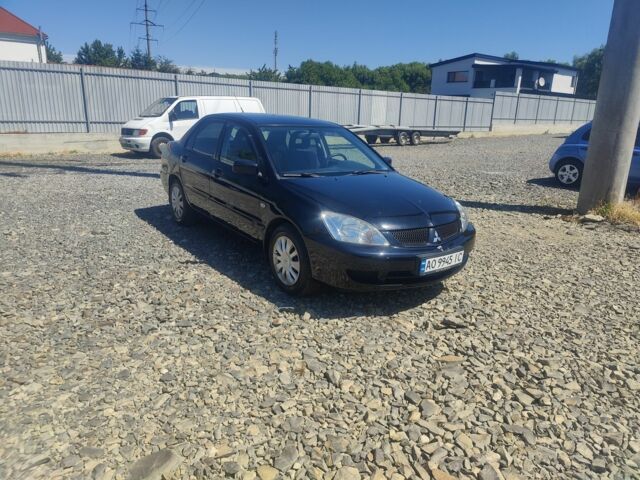 Черный Мицубиси Лансер, объемом двигателя 1.6 л и пробегом 211 тыс. км за 2850 $, фото 1 на Automoto.ua