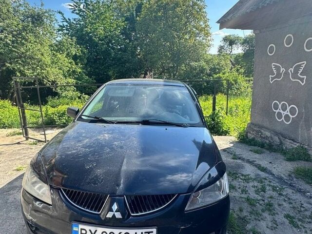 Чорний Міцубісі Lancer, об'ємом двигуна 1.58 л та пробігом 411 тис. км за 1000 $, фото 1 на Automoto.ua