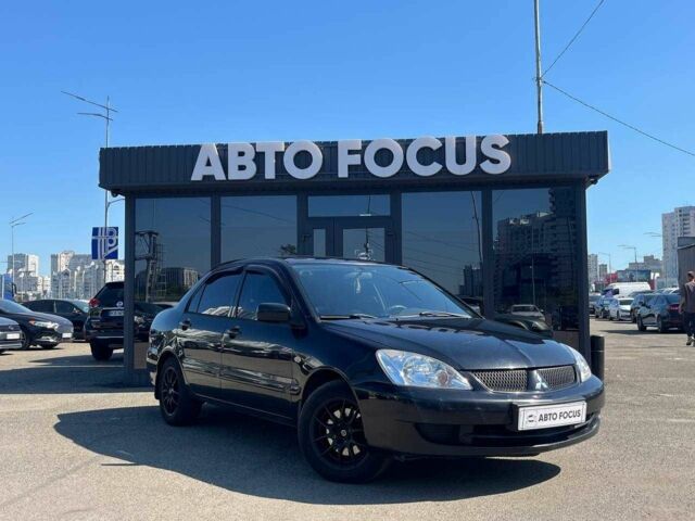 Чорний Міцубісі Lancer, об'ємом двигуна 2 л та пробігом 310 тис. км за 4990 $, фото 1 на Automoto.ua