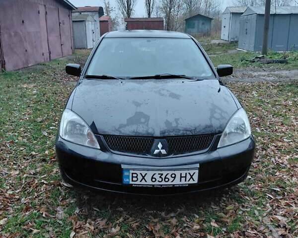 Черный Мицубиси Лансер, объемом двигателя 1.58 л и пробегом 238 тыс. км за 3500 $, фото 1 на Automoto.ua