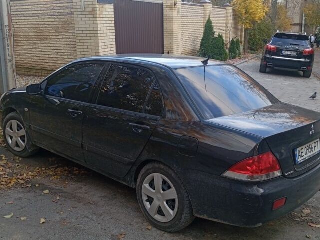 Чорний Міцубісі Lancer, об'ємом двигуна 1.6 л та пробігом 211 тис. км за 3700 $, фото 1 на Automoto.ua