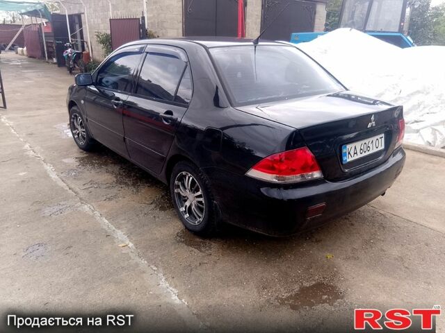 Чорний Міцубісі Lancer, об'ємом двигуна 1.6 л та пробігом 300 тис. км за 3700 $, фото 1 на Automoto.ua