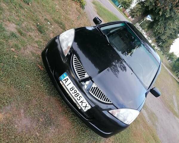 Чорний Міцубісі Lancer, об'ємом двигуна 1.58 л та пробігом 210 тис. км за 2999 $, фото 1 на Automoto.ua