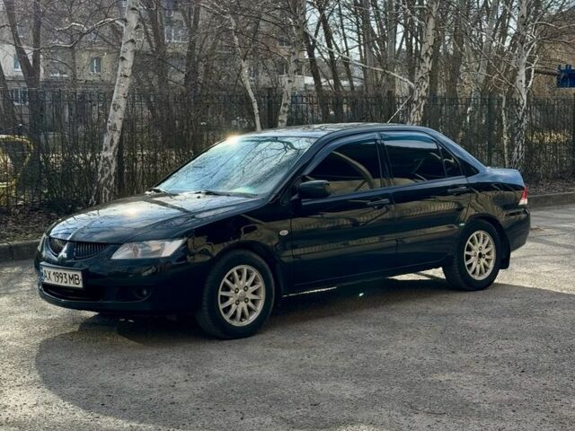 Чорний Міцубісі Lancer, об'ємом двигуна 1.6 л та пробігом 270 тис. км за 3900 $, фото 1 на Automoto.ua