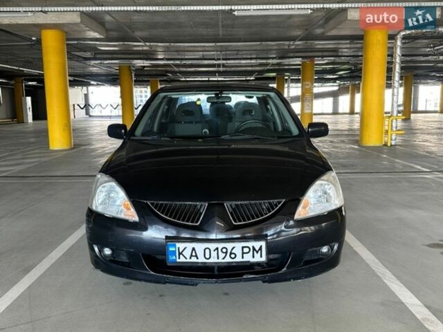Черный Мицубиси Лансер, объемом двигателя 1.58 л и пробегом 183 тыс. км за 3900 $, фото 1 на Automoto.ua