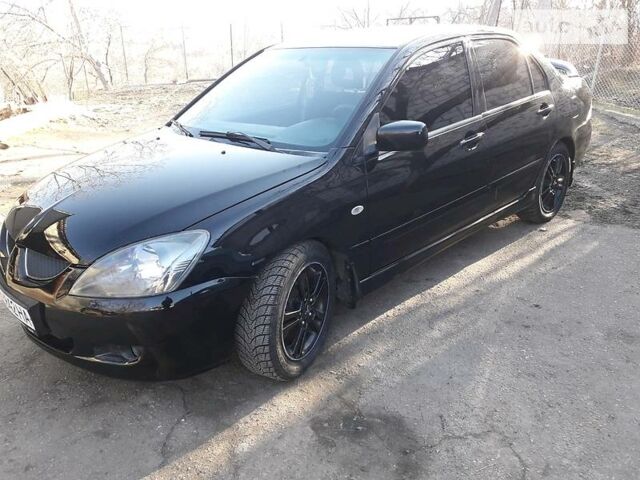 Чорний Міцубісі Lancer, об'ємом двигуна 2 л та пробігом 115 тис. км за 5600 $, фото 1 на Automoto.ua