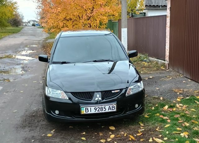 Чорний Міцубісі Lancer, об'ємом двигуна 1.6 л та пробігом 261 тис. км за 4400 $, фото 1 на Automoto.ua