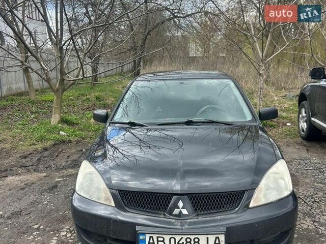 Черный Мицубиси Лансер, объемом двигателя 1.6 л и пробегом 260 тыс. км за 3800 $, фото 1 на Automoto.ua