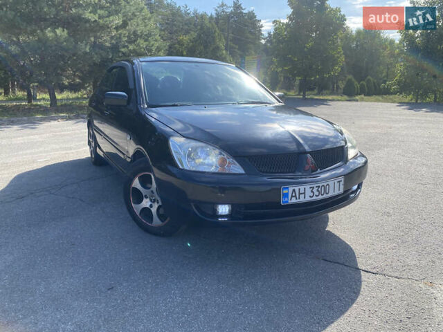Чорний Міцубісі Lancer, об'ємом двигуна 1.58 л та пробігом 236 тис. км за 4500 $, фото 1 на Automoto.ua