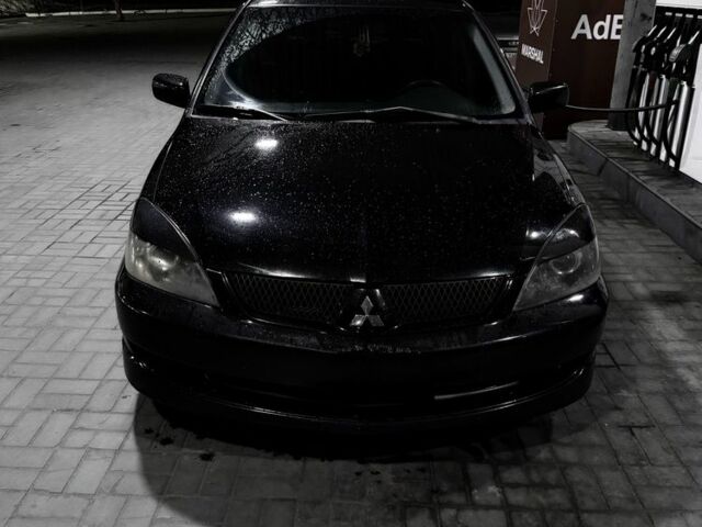 Чорний Міцубісі Lancer, об'ємом двигуна 2 л та пробігом 300 тис. км за 4100 $, фото 1 на Automoto.ua
