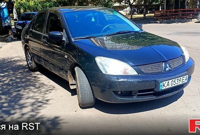 Черный Мицубиси Лансер, объемом двигателя 1.6 л и пробегом 238 тыс. км за 4300 $, фото 1 на Automoto.ua