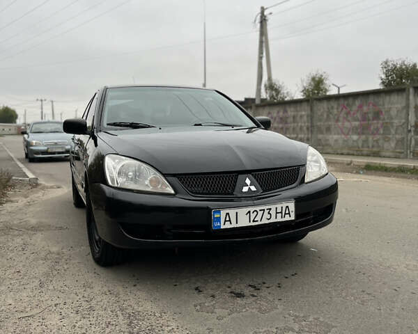 Чорний Міцубісі Lancer, об'ємом двигуна 1.58 л та пробігом 230 тис. км за 3350 $, фото 1 на Automoto.ua