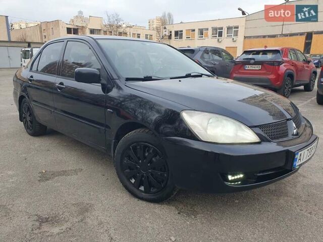 Черный Мицубиси Лансер, объемом двигателя 1.58 л и пробегом 222 тыс. км за 2999 $, фото 1 на Automoto.ua