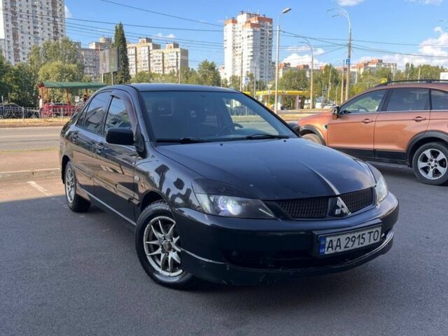 Чорний Міцубісі Lancer, об'ємом двигуна 2 л та пробігом 300 тис. км за 2614 $, фото 1 на Automoto.ua