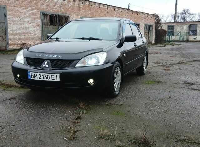 Черный Мицубиси Лансер, объемом двигателя 1.6 л и пробегом 230 тыс. км за 3250 $, фото 1 на Automoto.ua