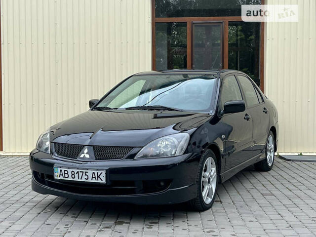 Чорний Міцубісі Lancer, об'ємом двигуна 2 л та пробігом 234 тис. км за 4999 $, фото 1 на Automoto.ua