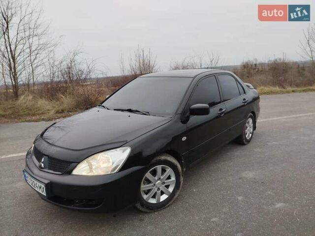 Чорний Міцубісі Lancer, об'ємом двигуна 1.6 л та пробігом 245 тис. км за 4000 $, фото 1 на Automoto.ua